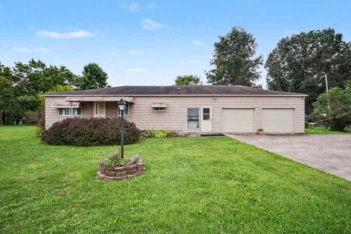 Exterior of 2336 W Fair Avenue, Lancaster, Ohio, a ranch home with an attached two-car garage and large front lawn